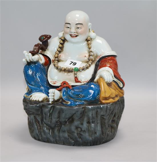 A Chinese figure of buddha H.26cm